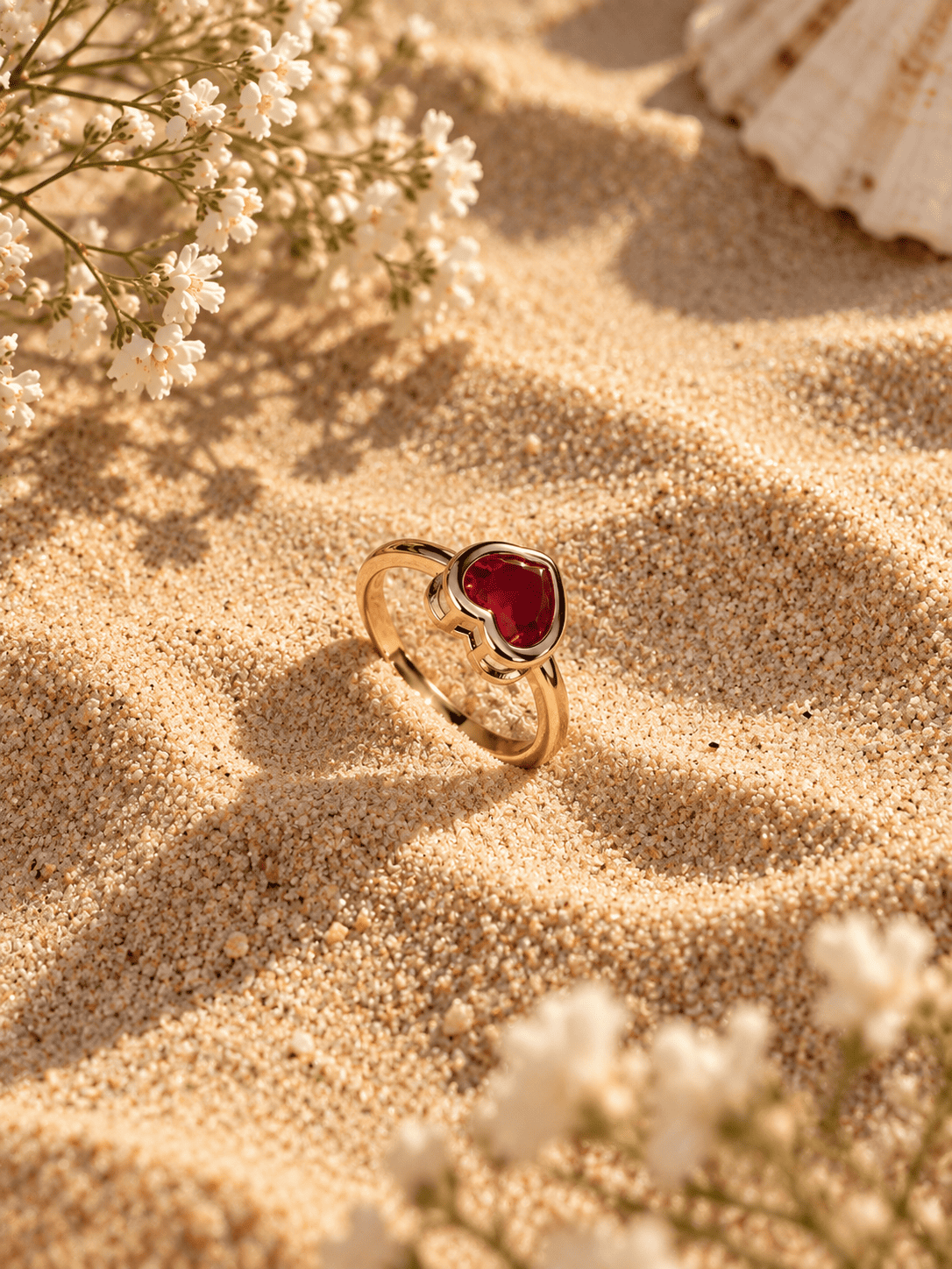 Red Heart Stone Ring for Women – Gold Tone 2 Red heart stone ring for women on sand